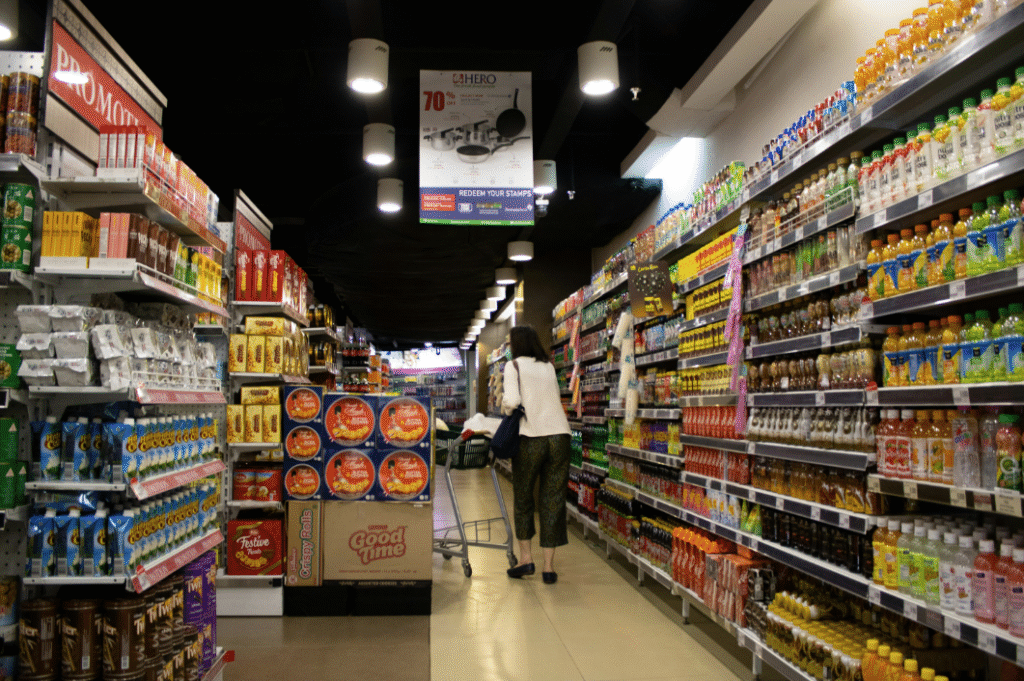 Gondola shelving in a retail store aisle displaying products in an organized, easy-to-browse layout.