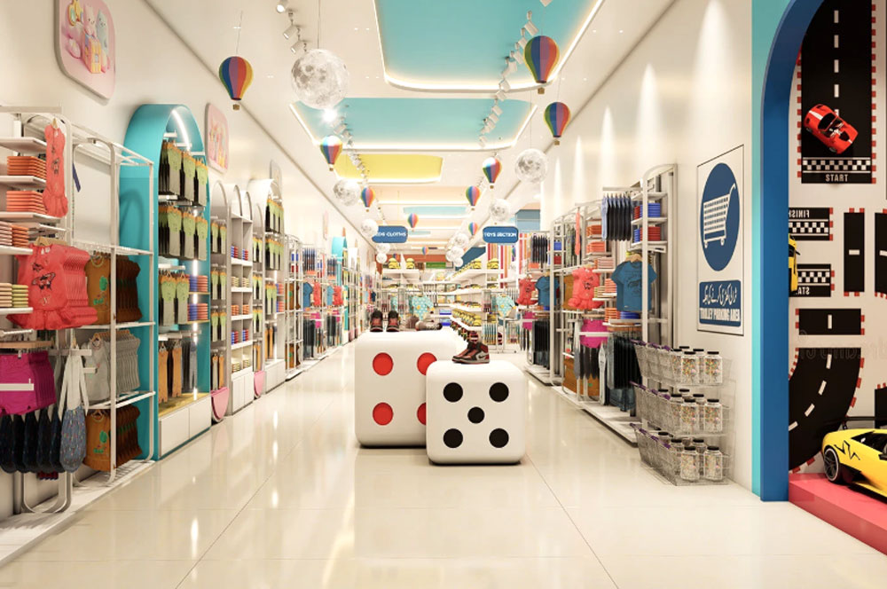 Seasonal window display featuring themed children's outfits and decorative elements