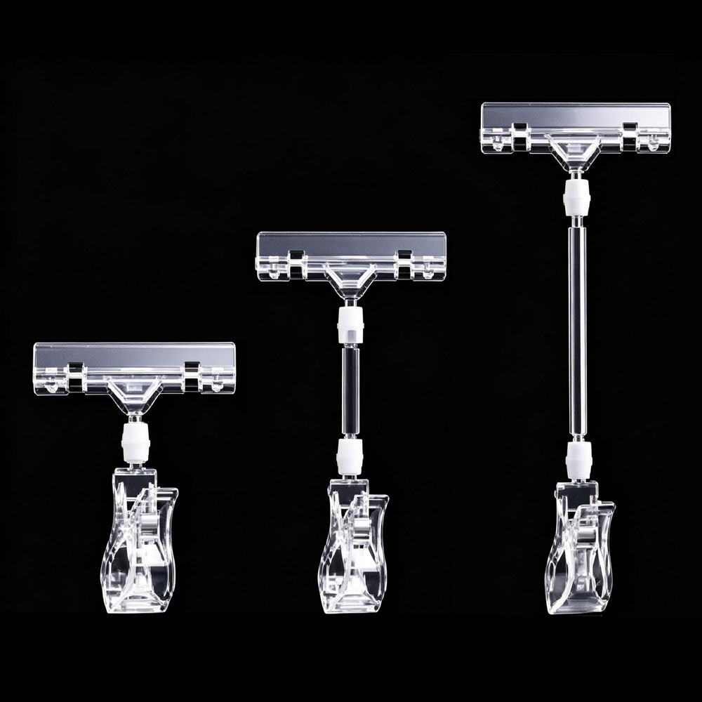 Bulk rotatable plastic pop sign clip holders and retail display price label tag clips for store shelving.