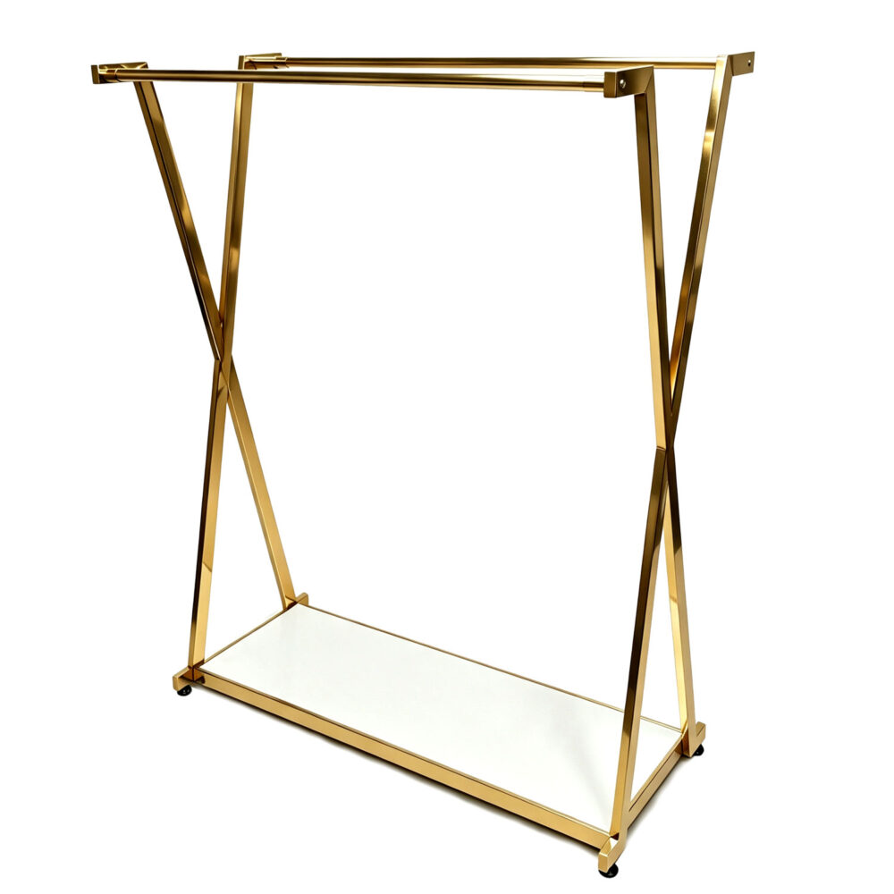 Commercial heavy-duty double rail gold X-frame garment rack CAD-X with white bottom shelf, isolated on white background.