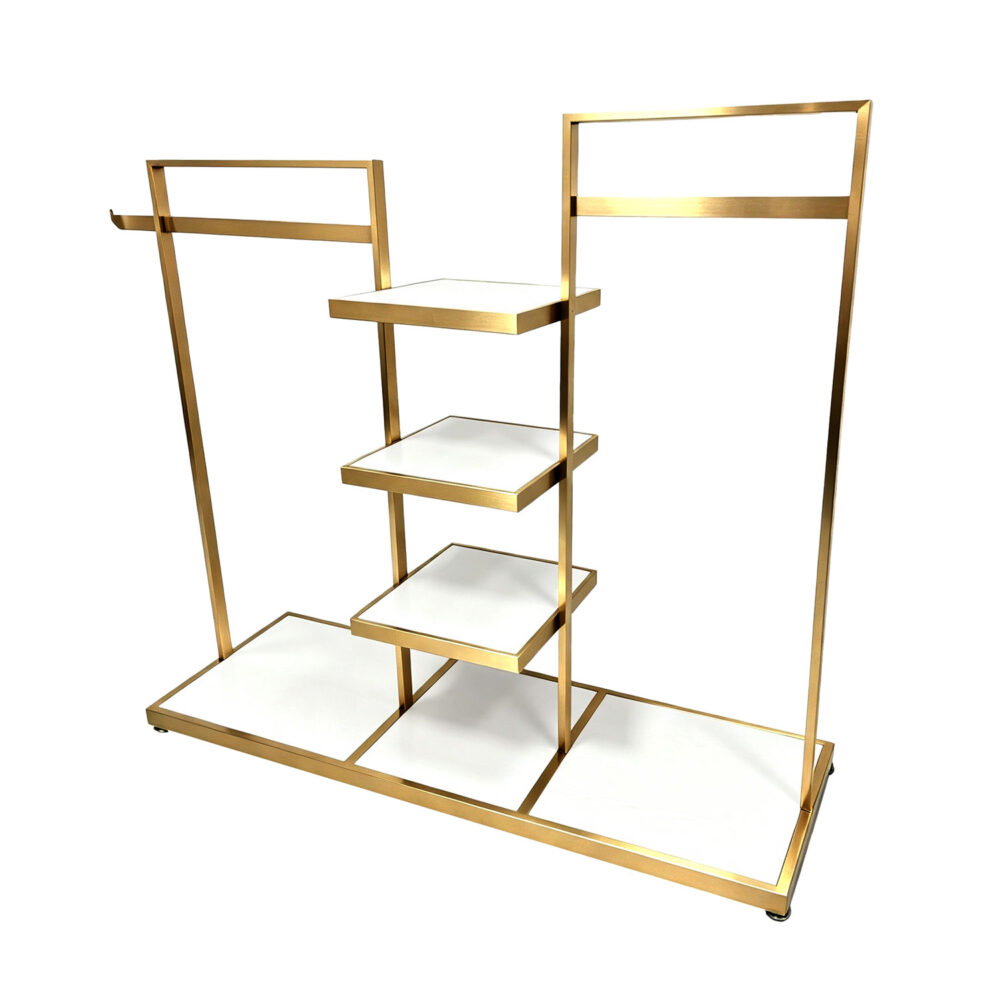 Titanium gold stainless steel multi-tier garment display rack with white wooden shelves, real product shot on white background.