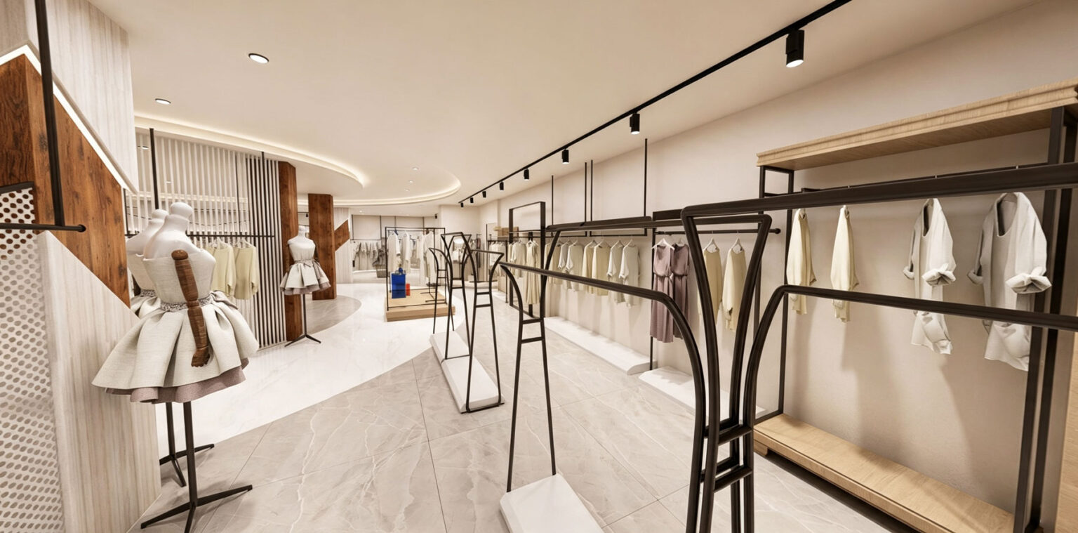 Boutique interior view with natural wood pillar accents, entrance mannequin pedestals, and modern white cash wrap desk.