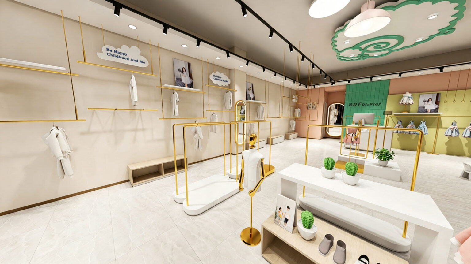 Wide perspective view of children's clothing store featuring gold dress mannequins, white nesting tables, and green accent backwalls