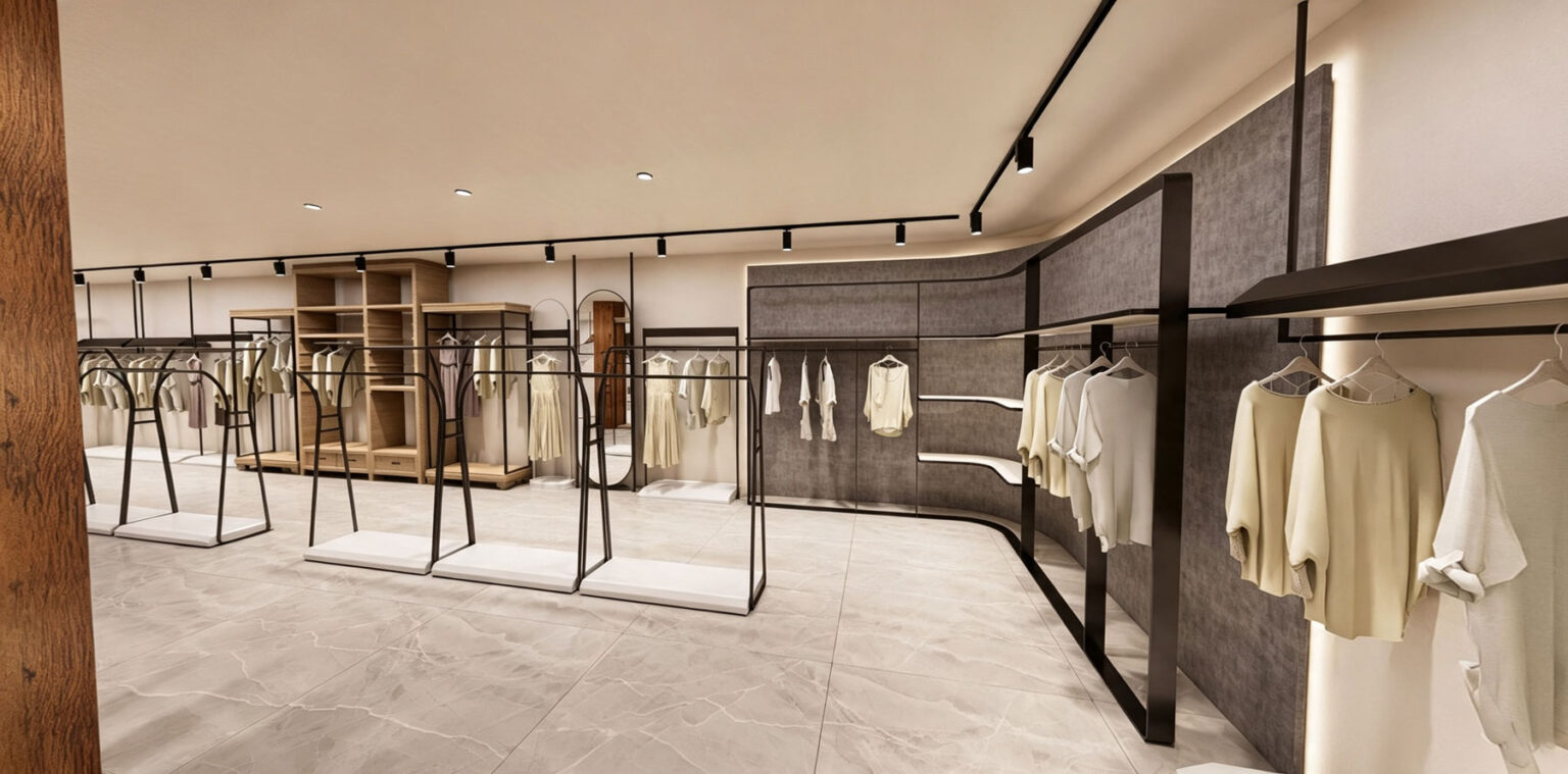 Mid-floor modular garment display island with black metal clothing racks and colorful acrylic display blocks.