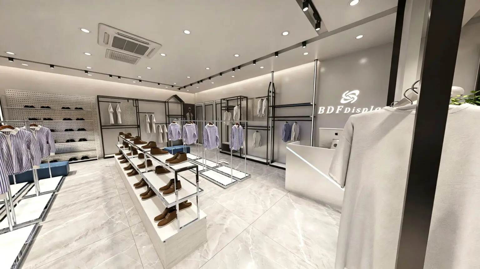 High-quality fiberglass male mannequins styled in casual menswear beside floor-standing island garment racks.