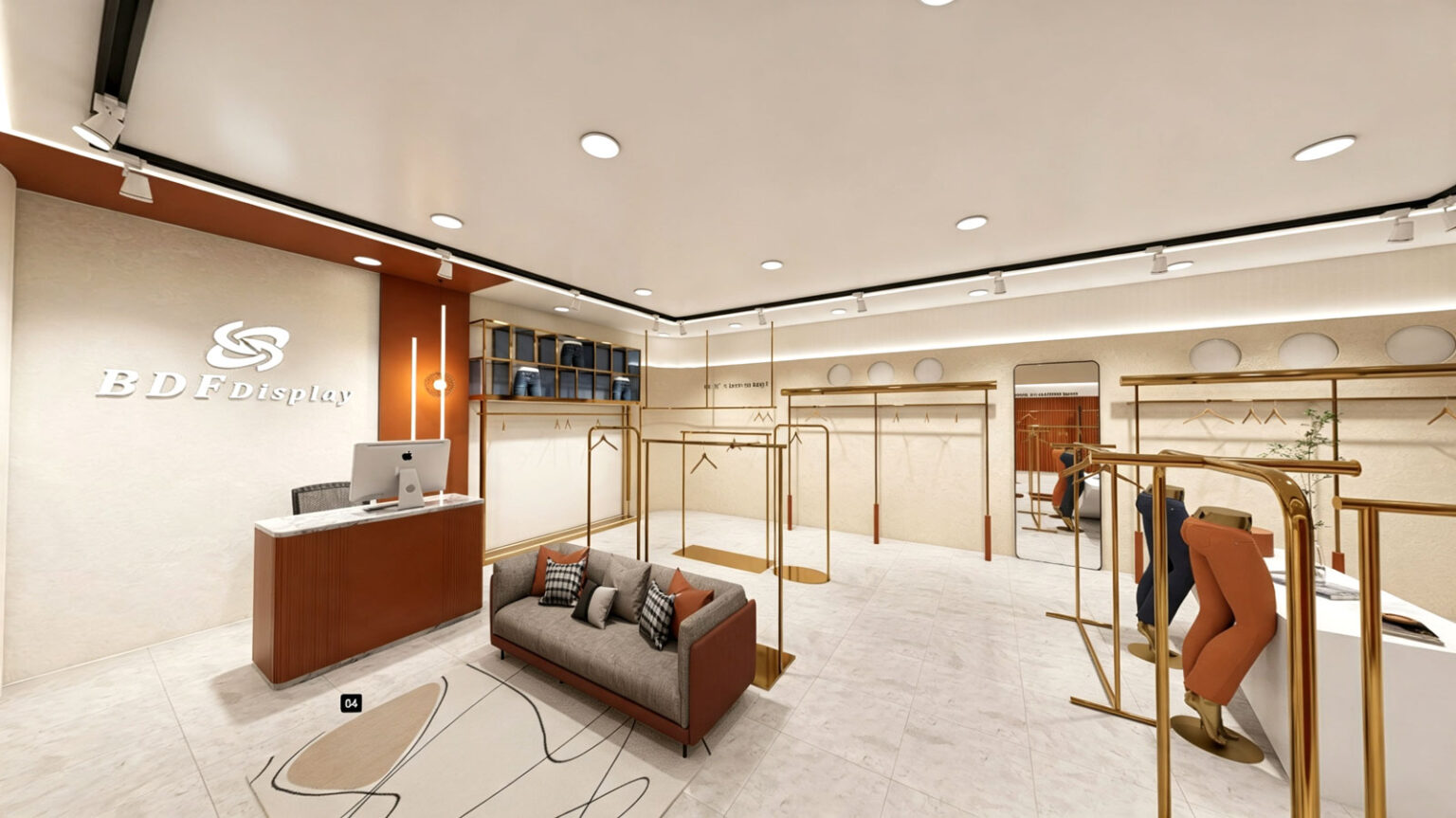 Central store view featuring gold freestanding garment racks, plush grey lounge sofa, and curved fitting room entrance